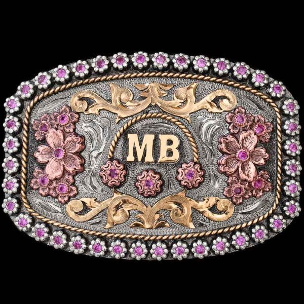 "The Floresville buckle is a true American Beauty. This gorgeous buckle is crafted on a hand engraved, German Silver base with a natural finish. It's detailed with an intricate berry edge filled with over 35 cubic zirconia stones. Inside the berry ed